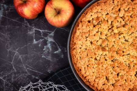 Traditional European apple pie with topping crumbles in springfo